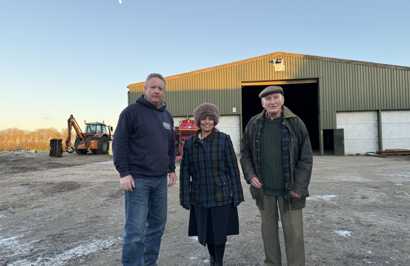 Priti with local farmers Steve and Robert Crayston