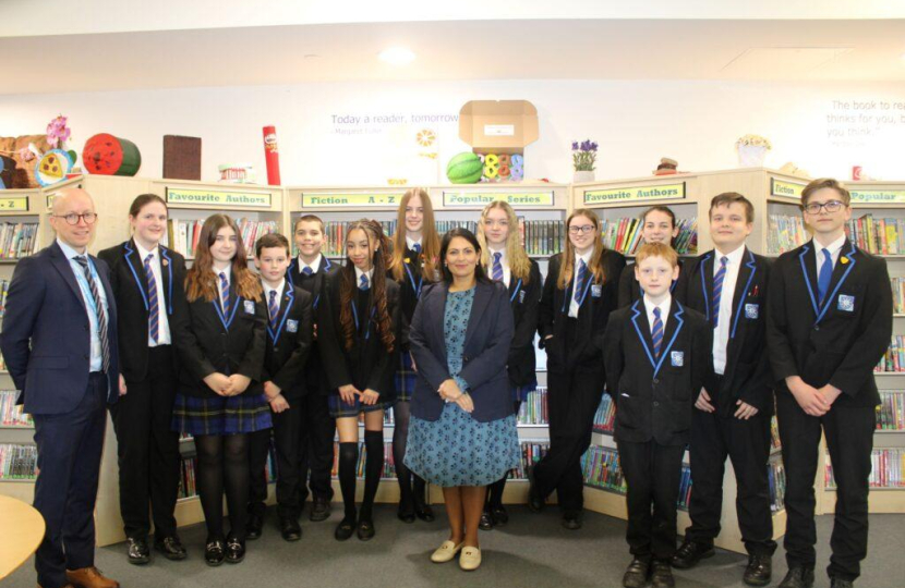 Priti Patel MP with the students who took part in the Q & A session and Head of School, Simon Gibbs.