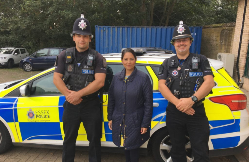 Priti alongside local Police Officers 