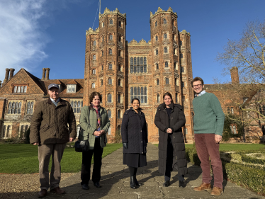 Priti outside the historic Layer Marney Tower with Nicholas Charrington, and local farmers Jimmy, Katie & Angela Strathern