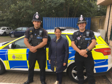 Priti alongside local Police Officers 